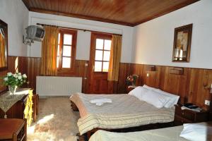 Voodi või voodid majutusasutuse Hotel Anax toas