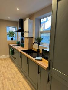 a kitchen with a sink and a counter top at Apartment 1 at Blackburn Heights Sleeps 2 in Bridlington