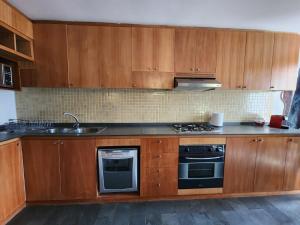 Кухня или мини-кухня в HOM I Departamento Valle Nevado con uso de Piscina
