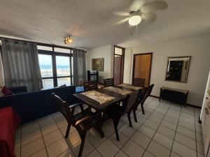 a dining room with a table and chairs at Cicada 8 in Ramsgate