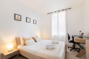 En eller flere senge i et værelse på Michaud Charming apartment near Paris + 10 billeder