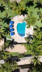 an overhead view of a resort with palm trees at Fiquei In Pipa - Chalé 21 in Pipa