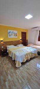 a hotel room with two beds in a room at Porto do Sol - Chalé 07 in Pipa +61 photos