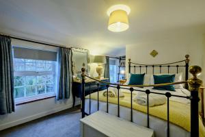 Voodi või voodid majutusasutuse Cobblers Cottage - Holt toas