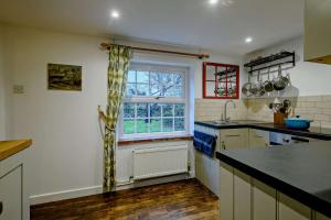 Köök või kööginurk majutusasutuses Cobblers Cottage - Holt