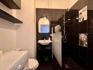 a bathroom with a sink and a toilet at Green Escape Gdańsk in Gdańsk