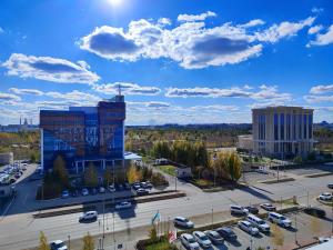 an aerial view of a parking lot and buildings at Ibis Aktobe in Aktobe