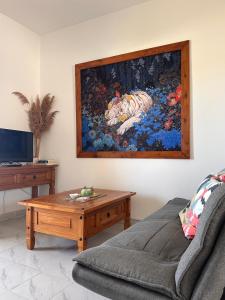 a living room with a couch and a table at Tina’s Cozy Studio in Polis Chrysochous
