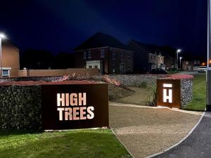 a sign that says high trees on the side of a road at Double Room in Luxury High Trees Development in Donaghadee +5 photos