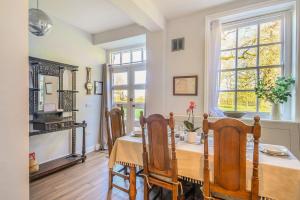 a dining room with a table and chairs at The East Wing in Wymondham