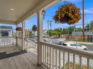 a porch with a wreath of flowers on it at The Meadow in Tacoma