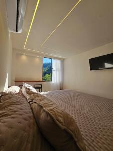 Postel nebo postele na pokoji v ubytování Apartamento Imperial