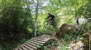 a man riding a bike jumping over a rock at Casale Sant'Elia in Capranica