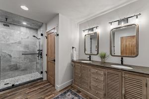 a bathroom with two sinks and a shower at Aska Acres in Greens Mill +49 photos