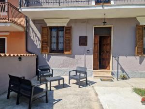 a group of chairs sitting outside of a house at Alla Fonte in Massa dʼAlbe +31 photos