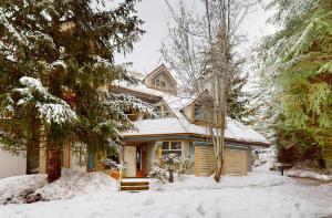 a house with snow on the ground in front of it at 31 GlenEagle in Whistler