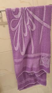 a purple towel sitting on top of a counter at Villa Saeed in Al Karnak +43 photos