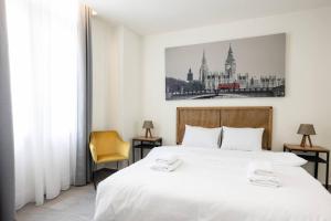 Ένα ή περισσότερα κρεβάτια σε δωμάτιο στο Aristotelous Downtown Suites