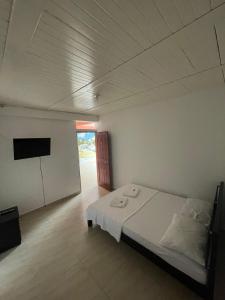 Postel nebo postele na pokoji v ubytování Hotel Marquez