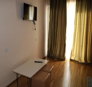 a room with a table and a chair and a window at მეშვე, MESHVE in Tsʼageri +13 photos