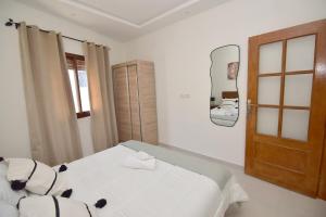 Ένα ή περισσότερα κρεβάτια σε δωμάτιο στο Le Joyau de Marchane