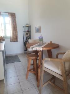 a dining room with a table and chairs at Bracciera Lipsi Apts 3 in Lipsoi +29 photos