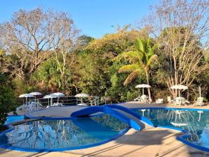 a swimming pool with a blue ribbon around it at Itiquira Park Hotel in Formosa