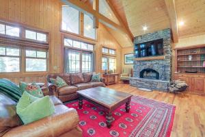 a living room with a couch and a fireplace at Golf, Hike and Trout Fish Mtn-View Cashiers Retreat in Norton