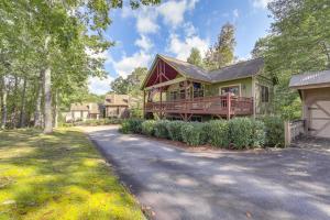 a house with a porch and a driveway at Golf, Hike and Trout Fish Mtn-View Cashiers Retreat in Norton