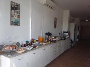 a kitchen with a counter with food on it at Tavira Monte in Tavira