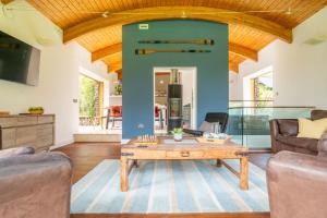 a living room with a wooden coffee table at Sedum House 8 in Gimingham
