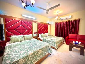 Ένα ή περισσότερα κρεβάτια σε δωμάτιο στο Hotel beachside