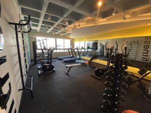 a gym with several treadmills and cardio machines at Smart Stay Experience in Maceió