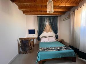 En eller flere senge i et værelse på Cozy House