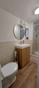 a bathroom with a toilet and a sink and a mirror at Liverpool Newington Stay in Liverpool +45 photos