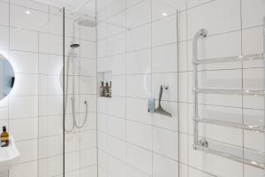 a bathroom with a shower with a glass door at Grace's Guesthouse Room 2 in Tring +28 photos