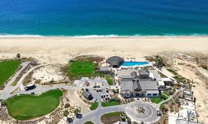 an aerial view of a resort and the beach at Stunning 2BR Condo - 5 Min to Beach in Cabo San Lucas