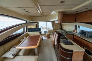 a kitchen and a living room in a boat at Azimut 58 in Panama City