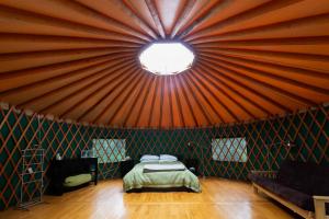 a room with a bed in a tent at Boreale Ranch in Carcross