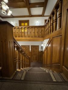 an image of a hallway with stairs in a building at Hotel Familiar in Kobyłka