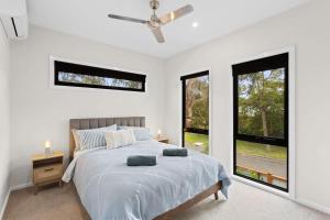 Ένα ή περισσότερα κρεβάτια σε δωμάτιο στο Townhouse Close to Shops and Beach +17 φωτογραφίες