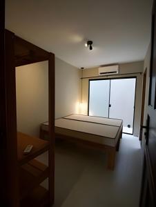 Ένα ή περισσότερα κρεβάτια σε δωμάτιο στο Casa com piscina privativa, 4 minutos da praia +31 φωτογραφίες