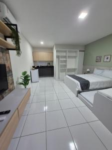 Ένα ή περισσότερα κρεβάτια σε δωμάτιο στο Residencial New Stilo-Coral