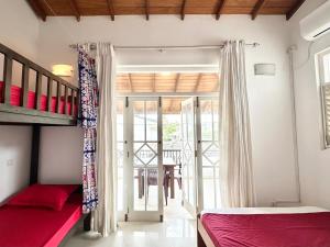 a bedroom with a bunk bed and a staircase at New Olive Villa in Negombo