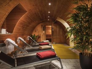 a wellness room with a sink and red towels at Offenburg City Hotel by Belvilla in Offenburg
