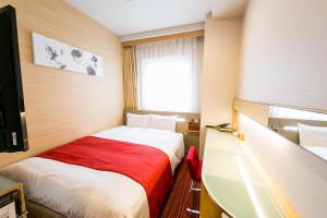 Postel nebo postele na pokoji v ubytování Hotel Sardonyx Ueno