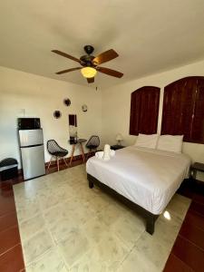 Ένα ή περισσότερα κρεβάτια σε δωμάτιο στο Oasis luminoso con piscina a un paso del centro +5 φωτογραφίες