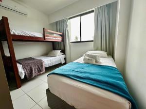 Postel nebo postele na pokoji v ubytování Mana Beach Muro Alto - 2 quartos e Varanda frente piscina + 29 fotografií