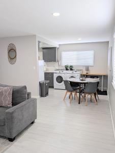 a kitchen and living room with a couch and a table at Explore DT Alhambra in Alhambra +20 photos