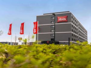 a tall building with aits signs in front of it at ibis Duesseldorf Airport in Düsseldorf